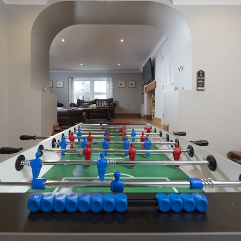 Get competitive on the apartment's foosball table