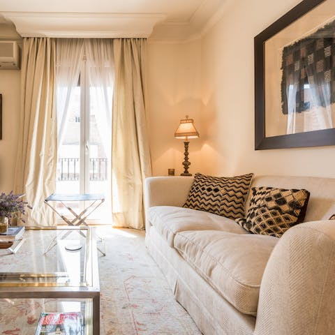 Relax in the bright and elegant living space after a day exploring the city