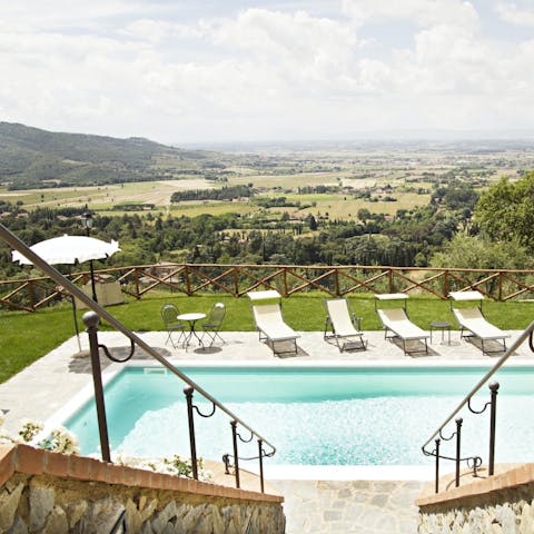Admire stunning Tuscan views from beside the beautiful pool