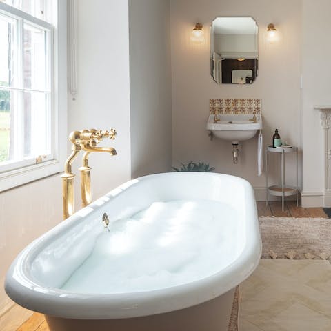 Treat yourself to a long, hot bubble bath in the freestanding tub