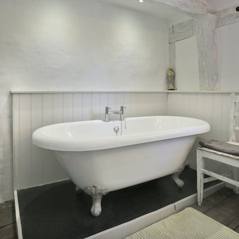 Pour in the bubbles and enjoy a soak in your roll-top bath