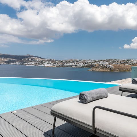 Admire the stunning views of Mykonos Town from the luxury of your infinity pool