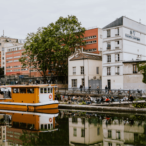 Discover Canal Saint-Martin's waterside cafés, a nine-minute stroll from your door