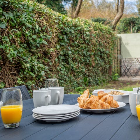 Enjoy a breakfast of bread and jam from the welcome hamper in the garden