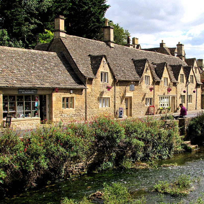 Explore the charming Cotswold village of Bibury, a thirty-minute drive away