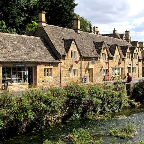 Explore the charming Cotswold village of Bibury, a thirty-minute drive away