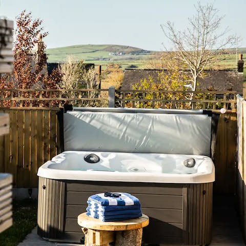 Experience the magic of the garden setting from the hot tub