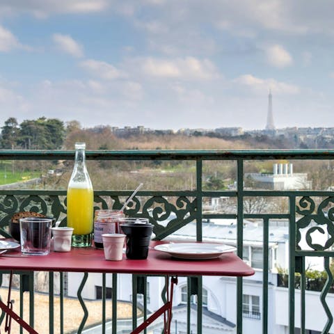 Admire the views over the iconic Eiffel Tower from the balcony