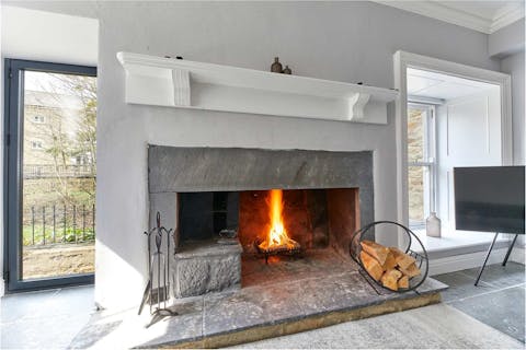 Get toasty and warm by the handsome stone fireplace