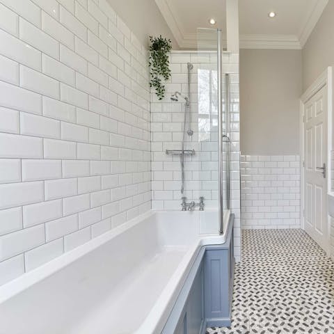Treat yourself to a relaxing soak in the home's chic bathroom