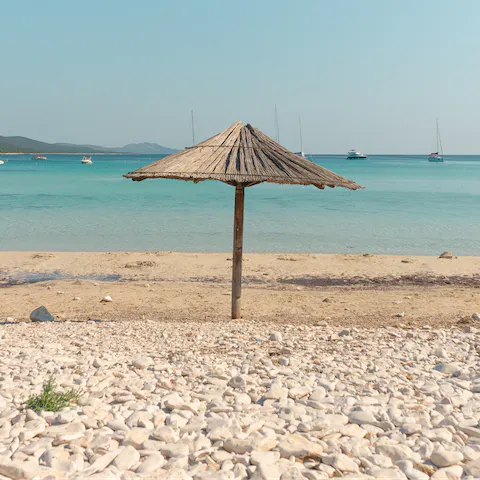 While away the hours on the sands of Paralia Katharos, a seven-minute drive away