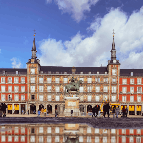 Soak up the Madrid atmosphere from Plaza Mayor, a short walk away