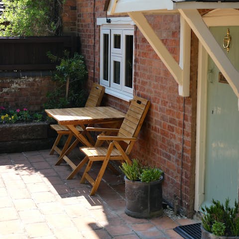 Enjoy an alfresco G&T on the small, sun-kissed patio