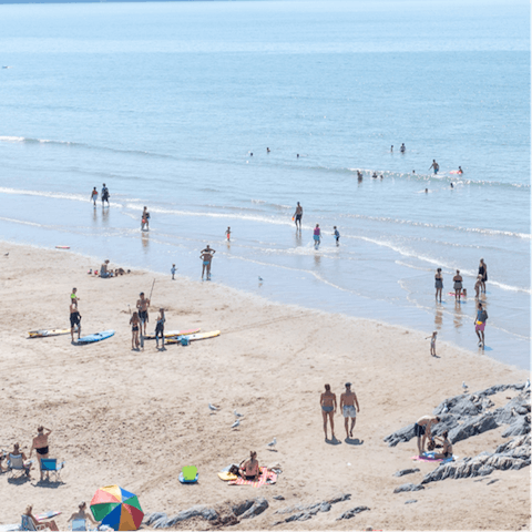 Feel the warmth of the sun while lounging on the sandy Croyde Beach, just a five minutes walk from your door