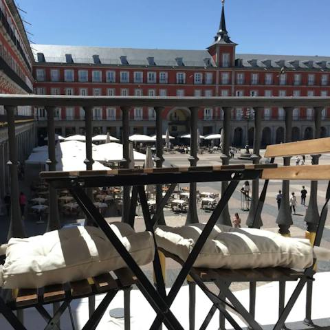 Sip a glass of tempranillo on your private balconette overlooking Plaza Mayor