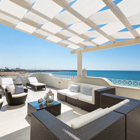 Relax and soak up the sun on the huge private terrace 