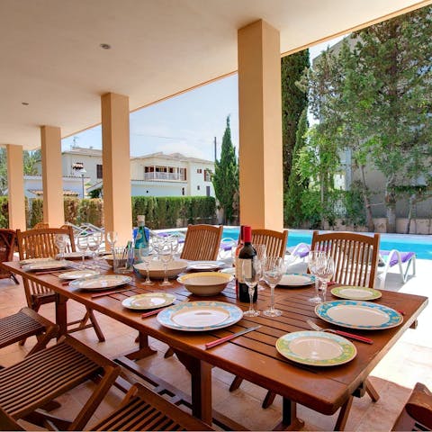 Dine alfresco on the shady terrace overlooking the pool