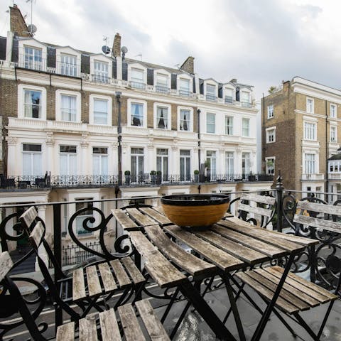 Relax on the terrace overlooking the characterful street