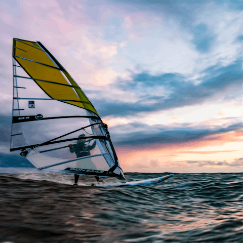 Try your hand at windsurfing in Schlei, a twenty-three-minute drive away