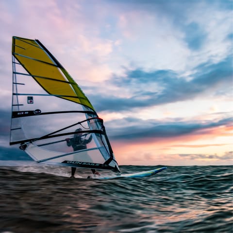 Try your hand at windsurfing in Schlei, a twenty-three-minute drive away
