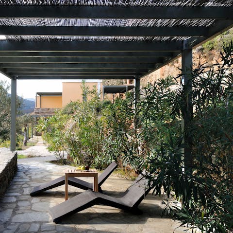 Stretch out with your holiday read under the shade of the pergola