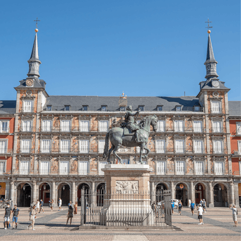 Walk ten minutes to Plaza Major, one of Madrid's most famous sights