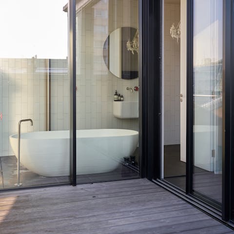 Treat yourself to a restorative soak in the eggshell-shaped bathtub with a glorious view