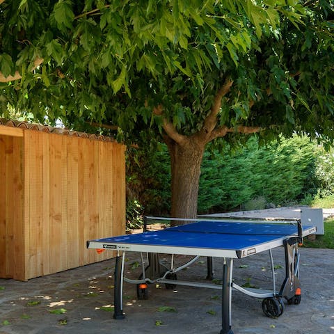 Play a game of table tennis in the shade to show off your competitive side