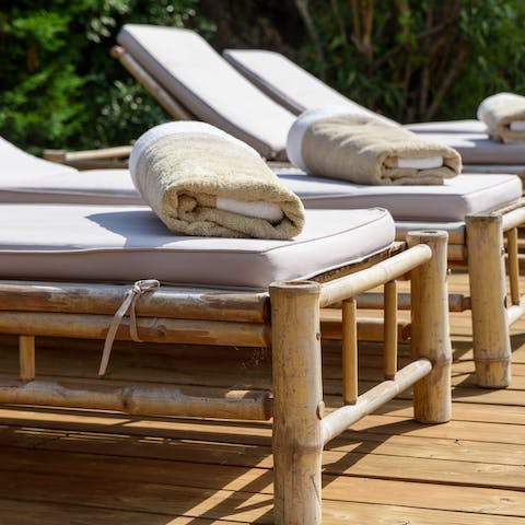 Unwind on the sun loungers in the bright sunshine