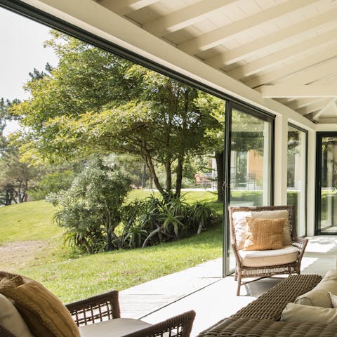 Sip on your morning coffee while admiring the leafy greenery from the glorious garden room