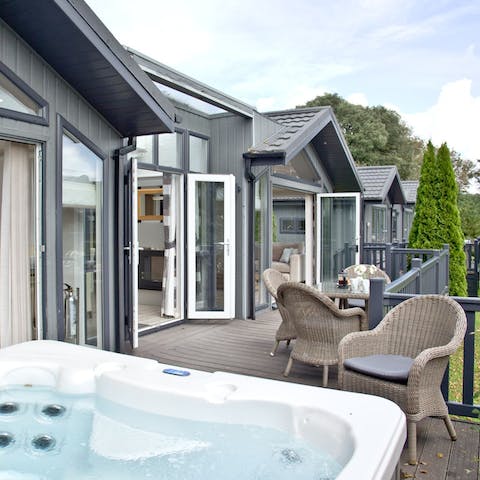Gaze out over the grounds from the comfort of your private hot tub