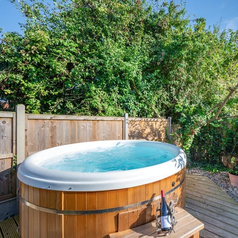 Unwind in your private hot tub as the sun is setting