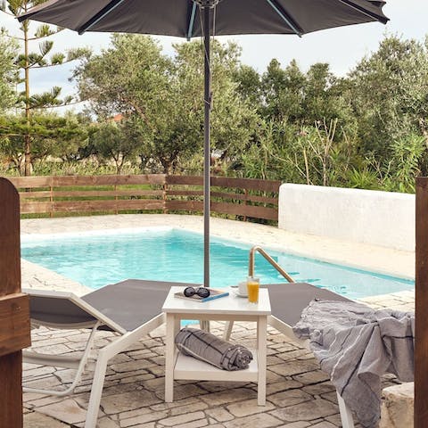Relax and unwind poolside under the hot Greek sun