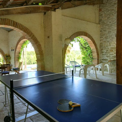 Challenge your loved ones to a few games of table tennis on the ping pong table