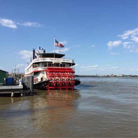 Sail along the Mississippi River on Steamboat Natchez, a fifteen-minute walk away