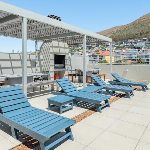 Laze on loungers or barbecue and dine alfresco on the communal rooftop while enjoying mesmerising mountain views