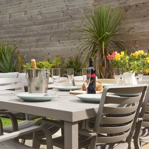 Fire up the charcoal barbecue and share a meal at the outdoor table 