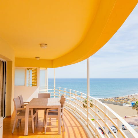 Enjoy a glass of sangria on the terrace while watching the seafront sunset