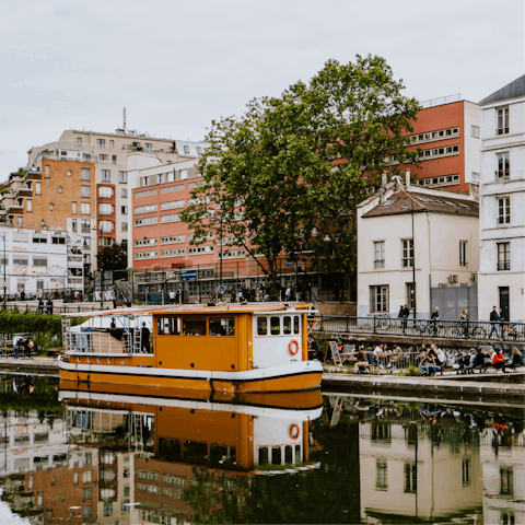 Walk along the scenic Canal Saint-Martin, ten minutes away on foot