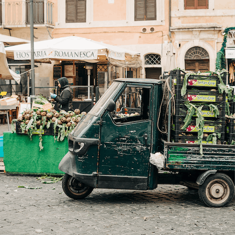 Browse the market stalls at Campo de’ Fiori