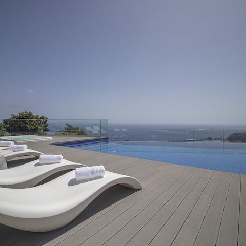 Spend the day by the pool, overlooking the vista