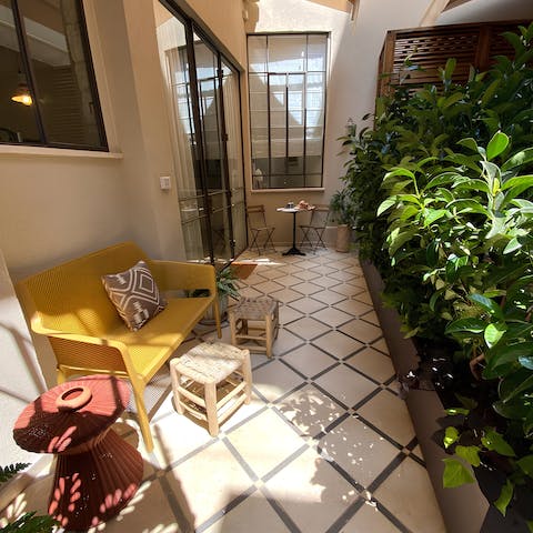 Find a moment's peace in the shared courtyard patio