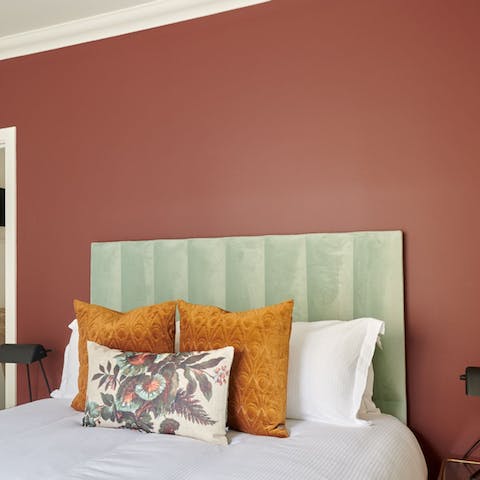 Rest your head on super-plush pillows and a velvet headboard