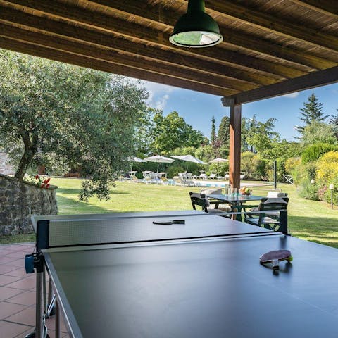 Get competitive with an outdoor game of table tennis