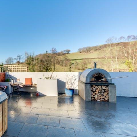 Enjoy balmy evenings in your spacious garden, firing up the log-fired pizza oven for a treat