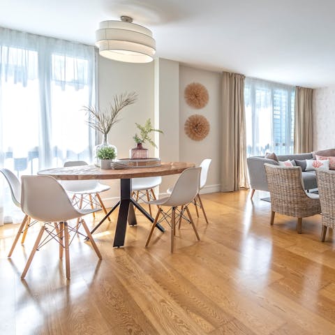 Share plates of tapas on the circular, wooden table