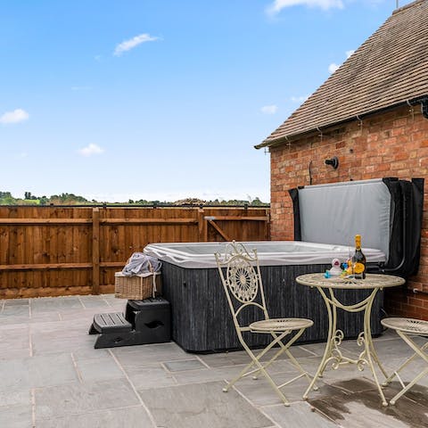 Admire the countryside views from the hot tub