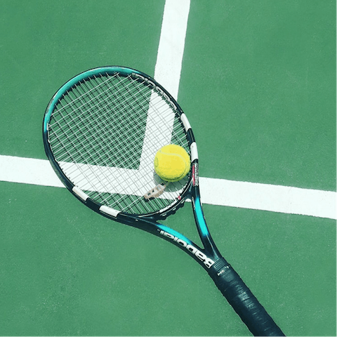 Work on your serve at one of the four shared tennis courts