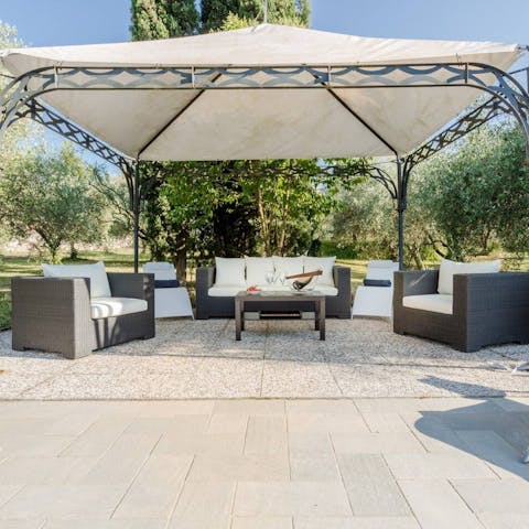 Relax under the gentle shade of the veranda covered patio area