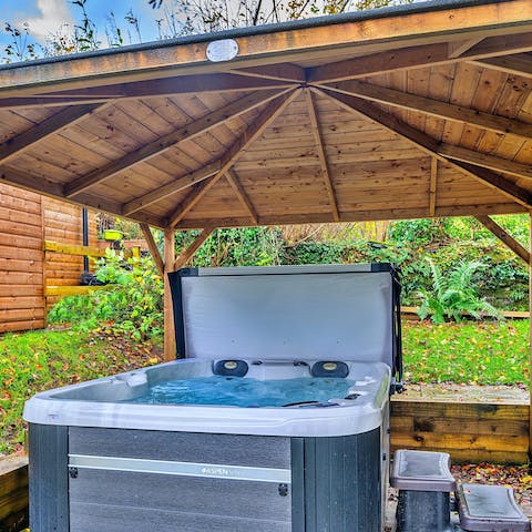 Spend evenings unwinding in the hot tub with a drink or two